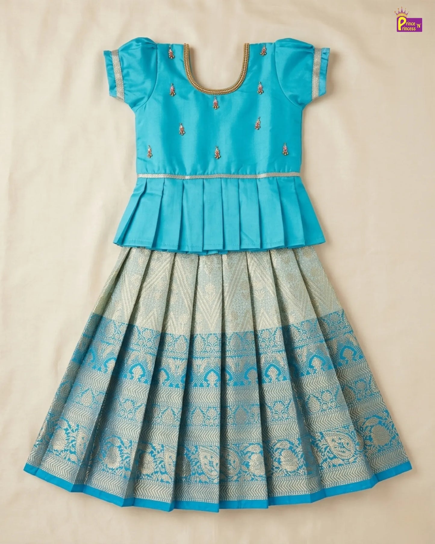 Blue and white traditional outfit on a beige background