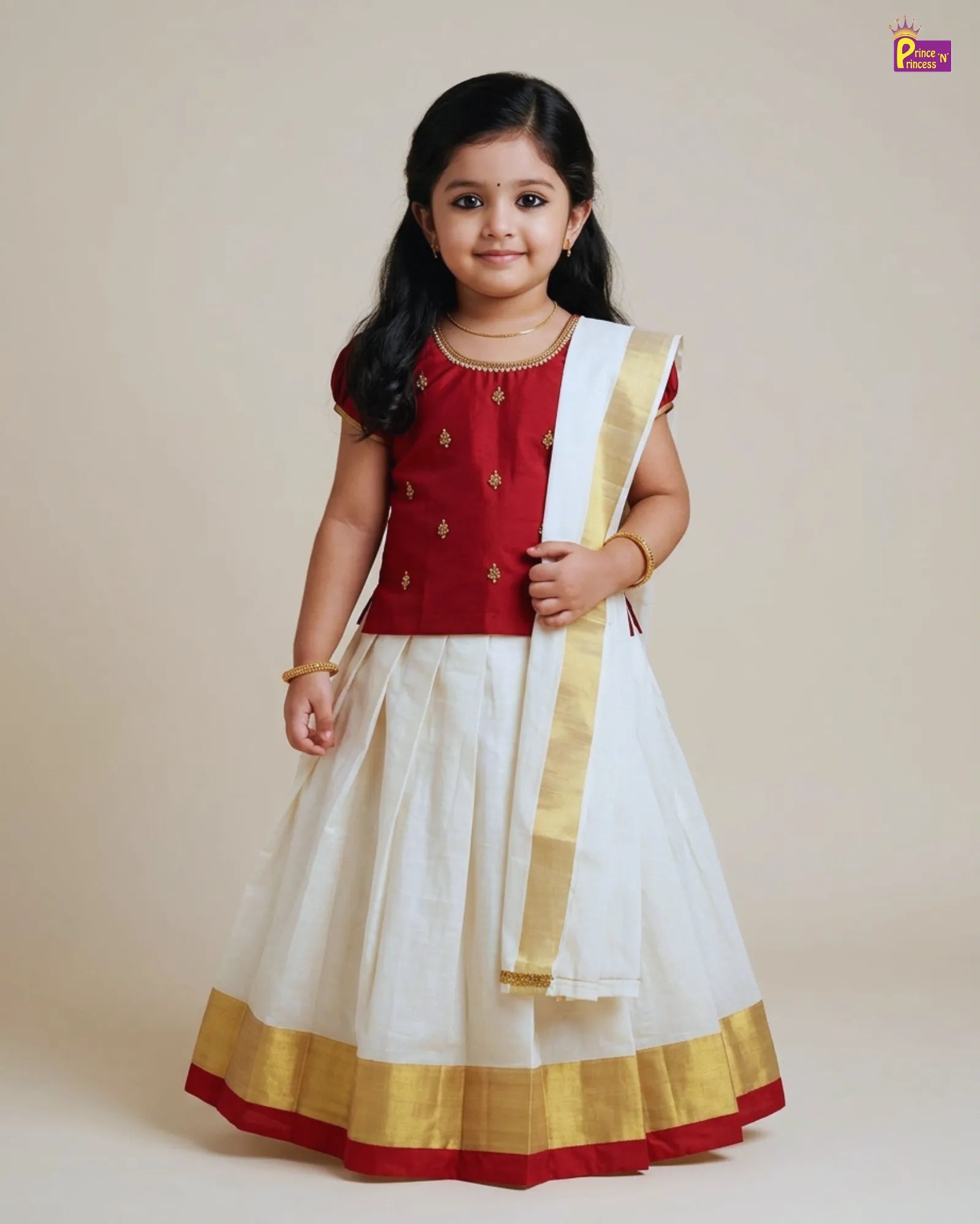 Young girl wearing a traditional outfit with a red blouse and white skirt on a plain background
