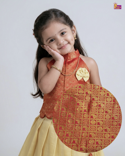 Young girl in traditional outfit with decorative panel, on a plain background