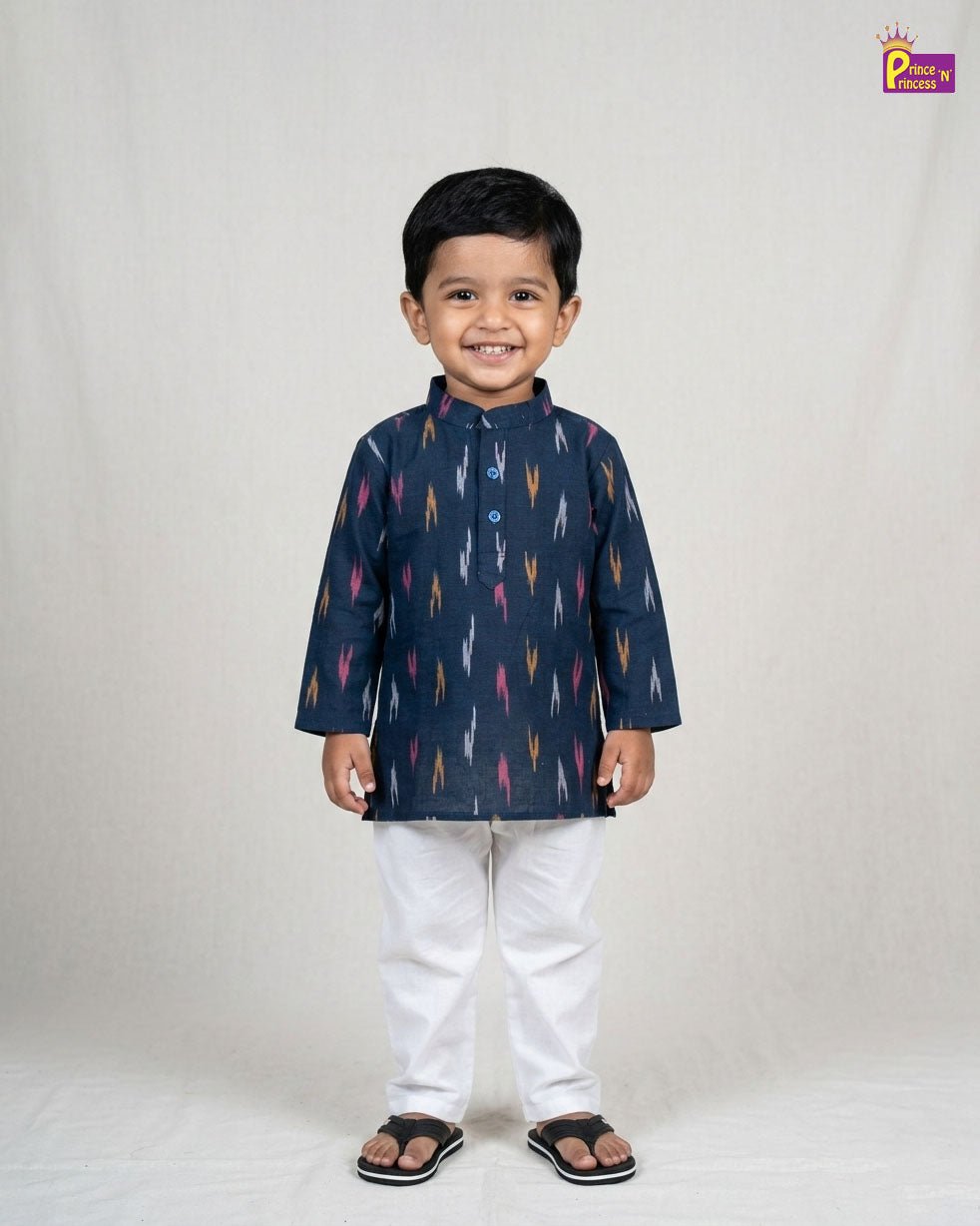 Child wearing a navy blue kurta with colorful patterns on a white background
