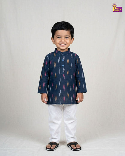 Child wearing a navy blue kurta with colorful patterns on a white background