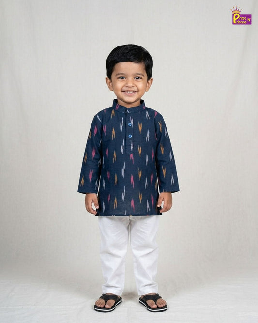 Child wearing a navy blue kurta with colorful patterns on a white background