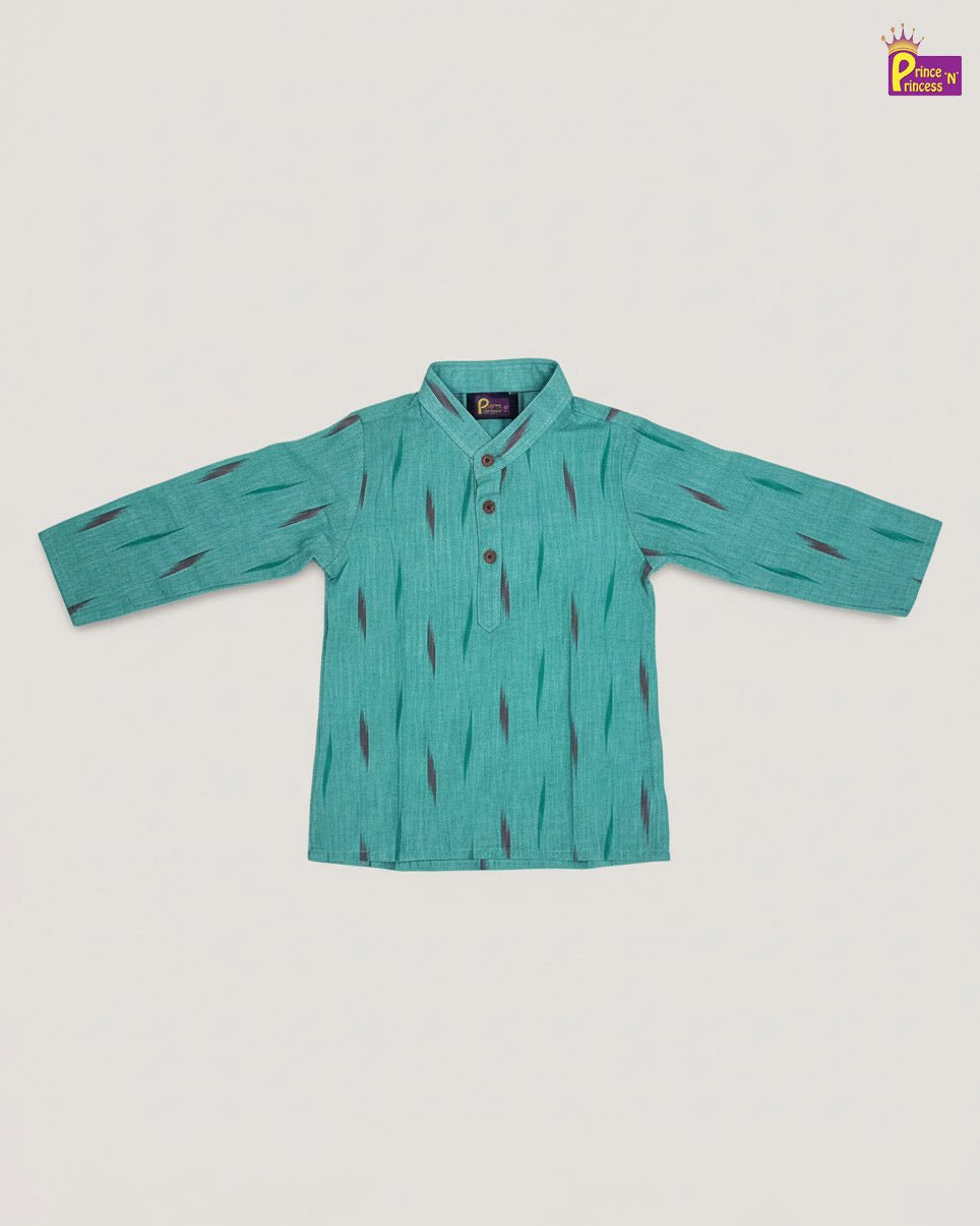 Teal shirt with black patterns on a light gray background