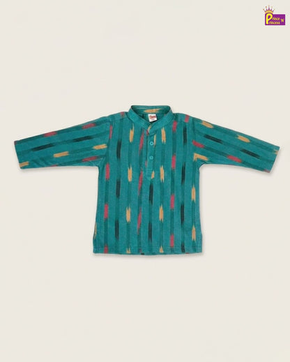 Teal children's shirt with colorful patterns on a beige background