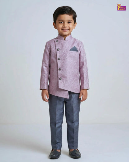 Young boy wearing a traditional outfit with a light purple jacket and dark pants on a white background.