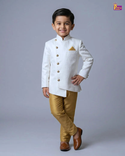 Child wearing a white traditional outfit with gold accents on a gray background