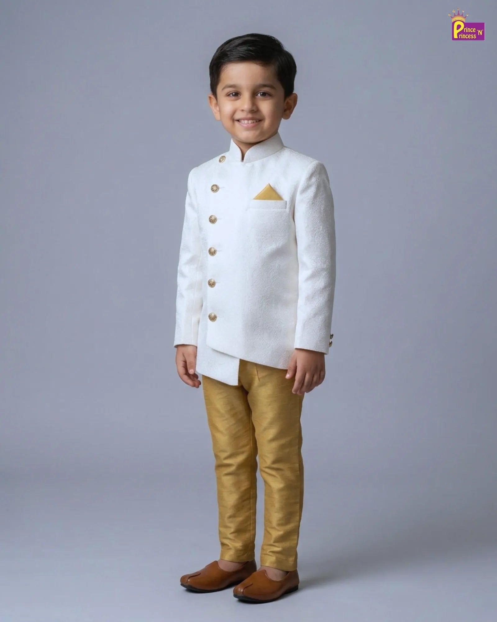 Child wearing a white traditional outfit with gold accents on a gray background