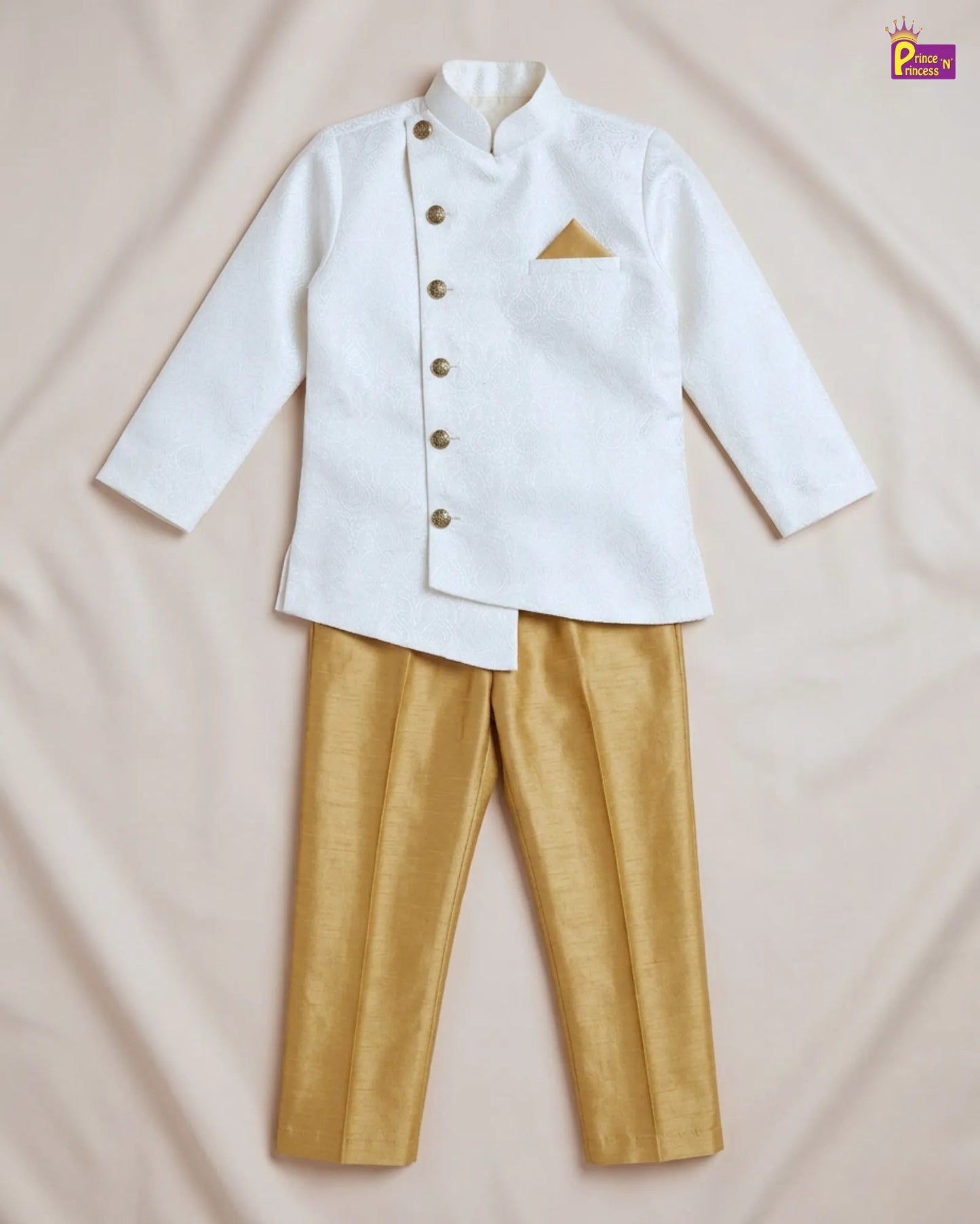 White shirt with gold buttons and matching pants on a beige background