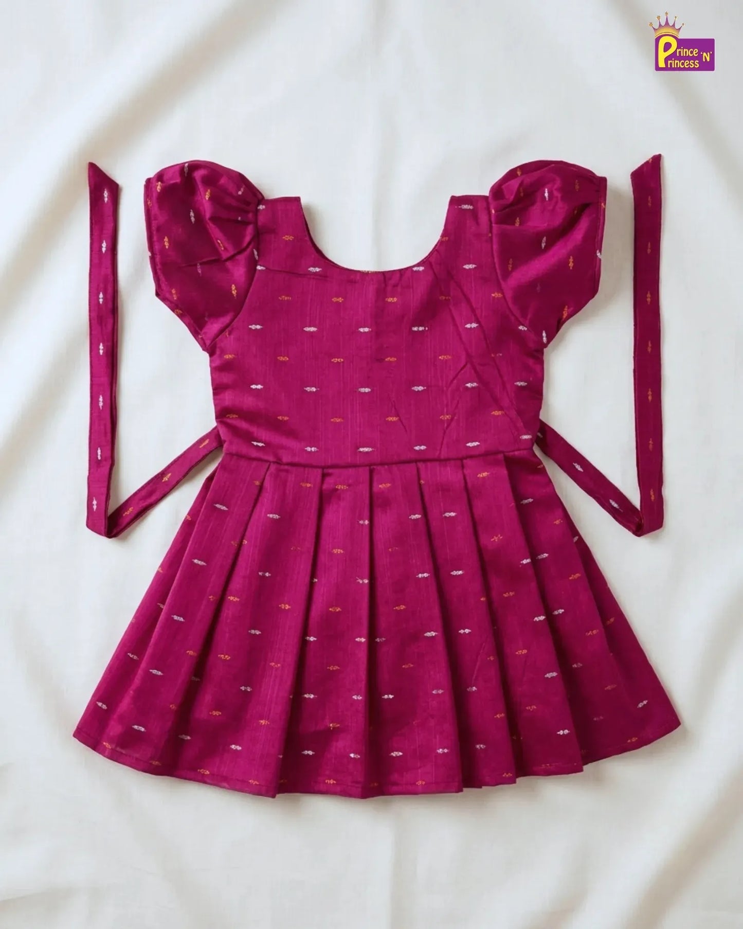 Pink dress with ruffled sleeves on a white background