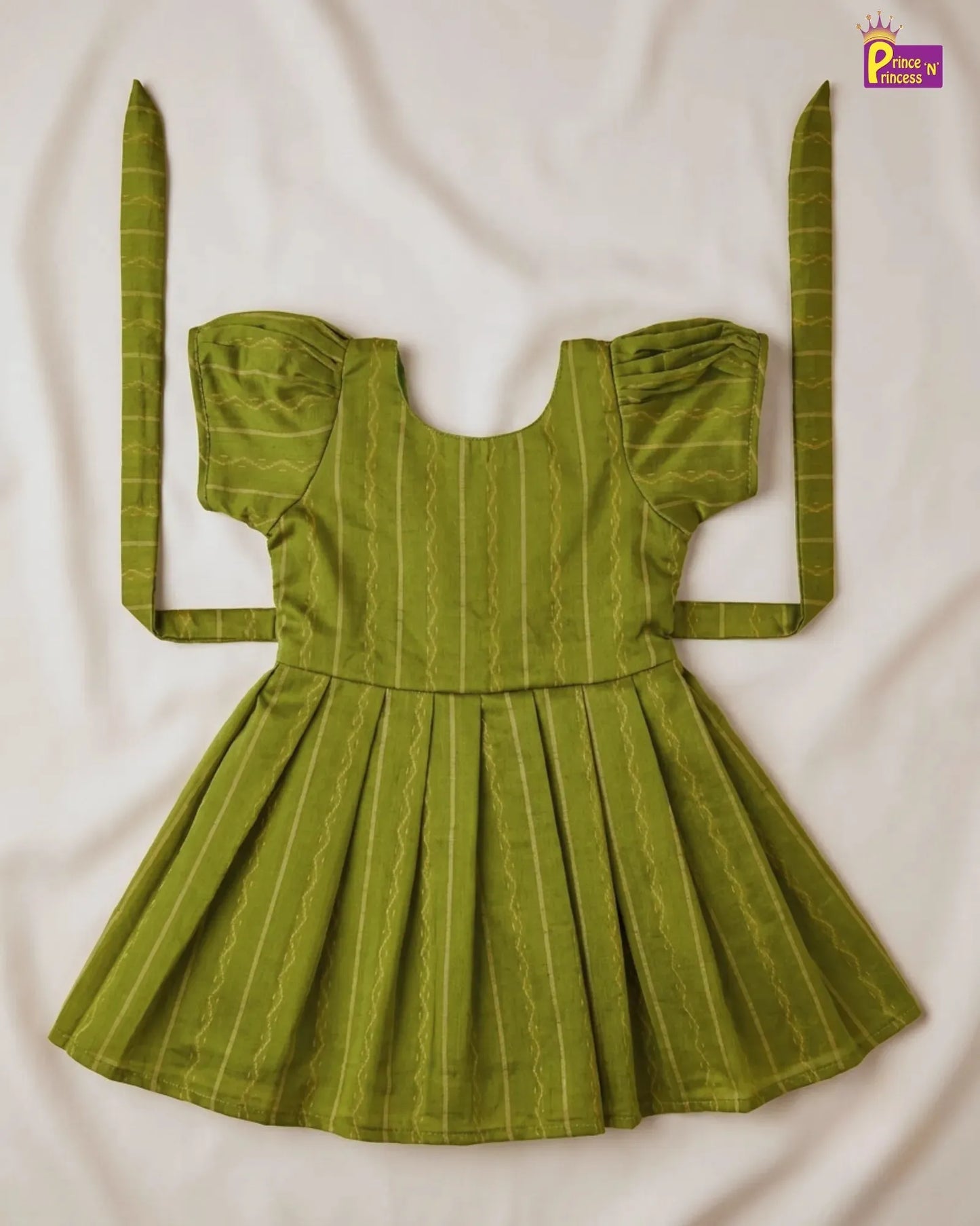 Green dress with long sleeves on a white background