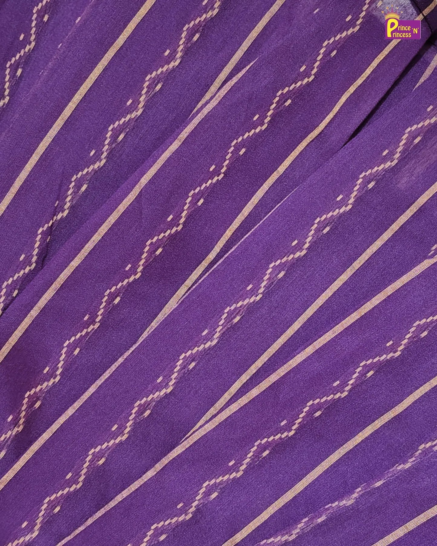 Close-up of purple fabric with white zigzag pattern
